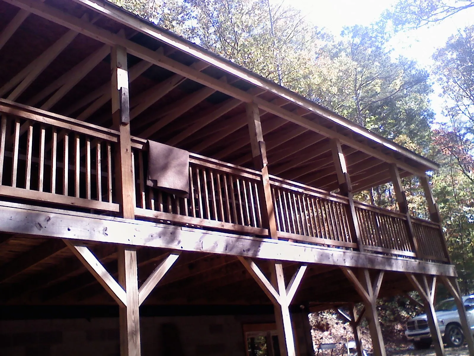 Timber framing under a new elevated porch and deck — Roof Leak Repair in Gorham by Roofing Brothers